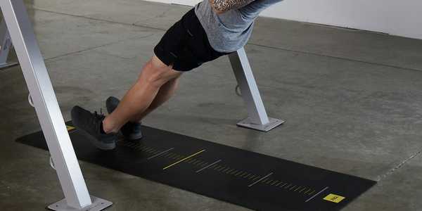 A man using TRX training mat in black colour. 